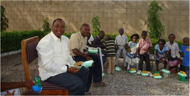 Brother Bernard Gazire (left) with local children during the 2012 Christmas Party.