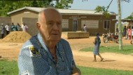 Br Joe outside the health clinic in Nakolo, which he helped develop.