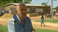Br Joe outside the health clinic in Nakolo, which he helped develop.